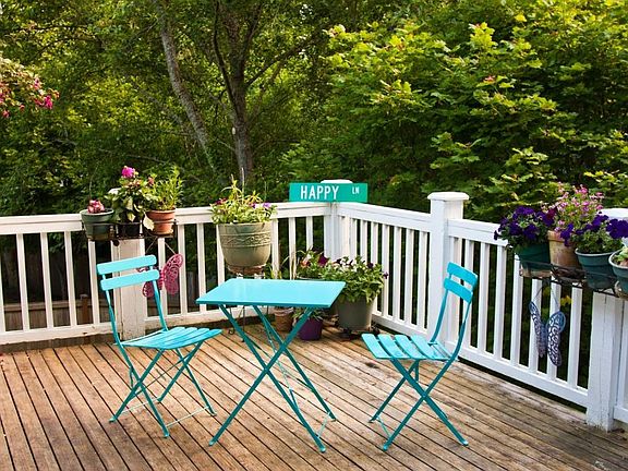 Back deck with staircase access to backyard