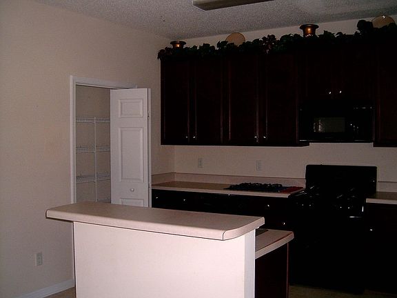 island and cherry cabinets