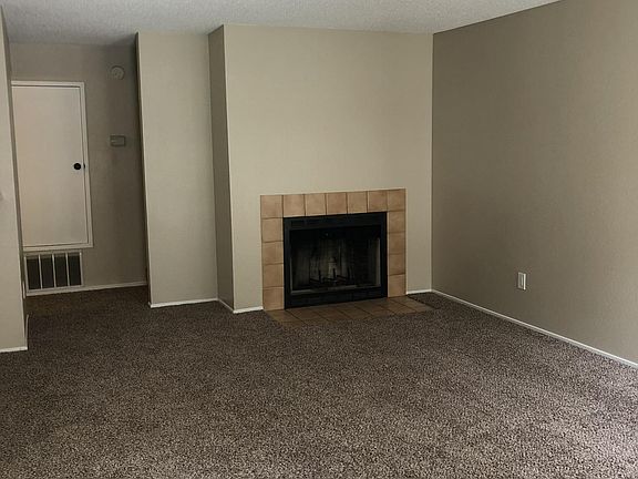 Living room with wood burning fire place