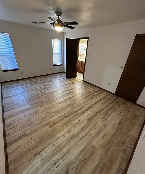 Primary Bedroom with ceiling fan