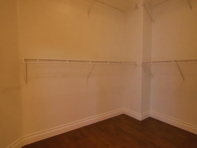 Walk-in closet next to master bathroom