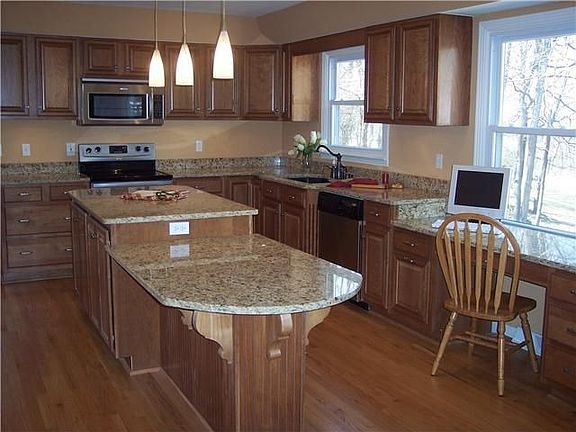 Brand New Open Kitchen! Cherry glazed cabinets and New Venetian Gold Granite.