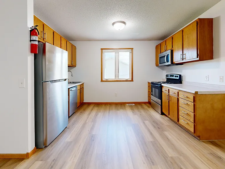 Kitchen with all stainless steel appliances
*Not shown in photo: new base cabinets and countertop in progress