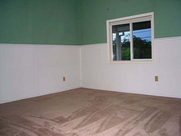 The other bedroom down, great wainscoting.