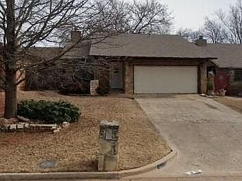 Front view, 2 car garage, front door to the left.