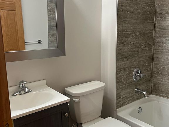 new bathroom vanity, toilet and tub