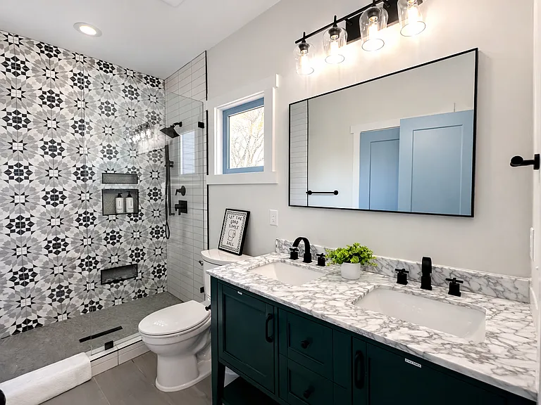 Located off The Beltline Suite (upstairs primary bedroom), this spa-inspired bath is pure luxury. Enjoy double sinks, walk-in shower, plush linens, designer interiors, and premium Apotheke products for a true boutique hotel experience.