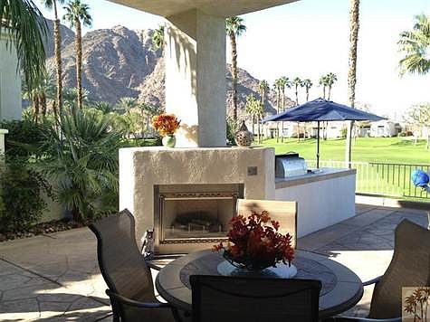 Large covered patio with views of golf course and mountains.  Fantastic outdoor living with fireplace and Island BBQ Center.