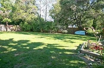 Spacious, flat and fully fenced backyard. 