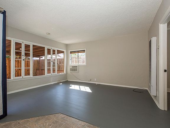 Living area with sliding doors to the private covered patio