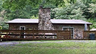 Wooded landscaping is viewed from this great deck off the front of the home