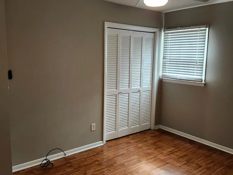 Master Bedroom, new ceiling fan, laminate flooring, sunlight, double door large closet.