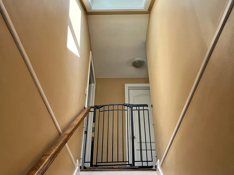Skylight over stairs is openable and closes automatically in rain.