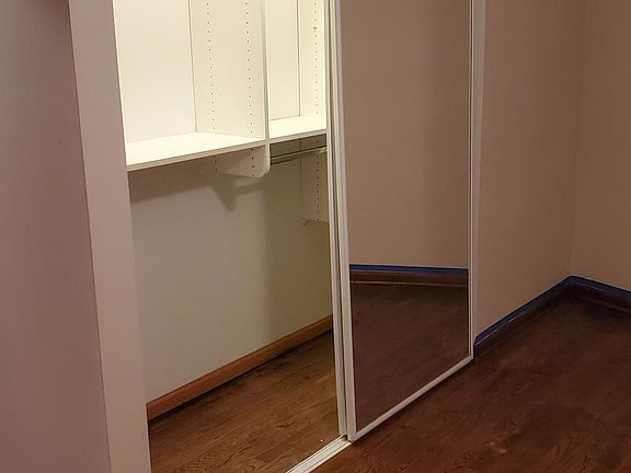 Bedroom closet w/ custom shelving system. over 6feet of closet space.