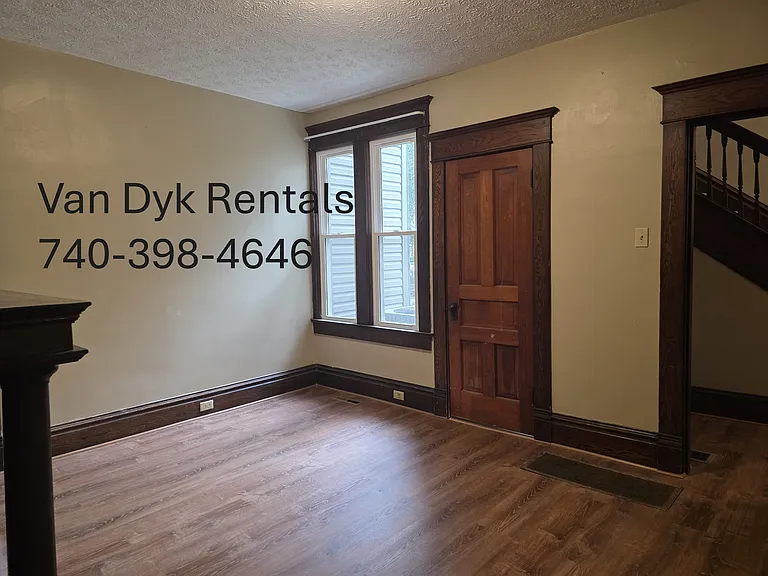 Dining room, view of 1/2 bath door and entry into foyer.