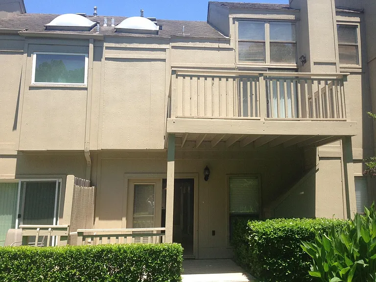 Back view of unit. Small patio on ground floor.