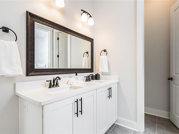 Double Vanity in owner s retreat with Under-mount sinks and Vanity Mirrors