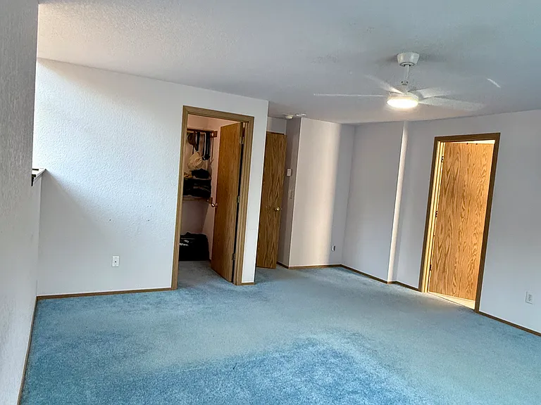Master's bedroom inside view with walk in closet and bathroom