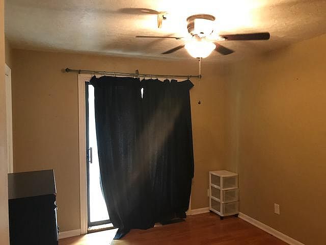 bedroom 3 has glass sliding doors to outside patio/deck