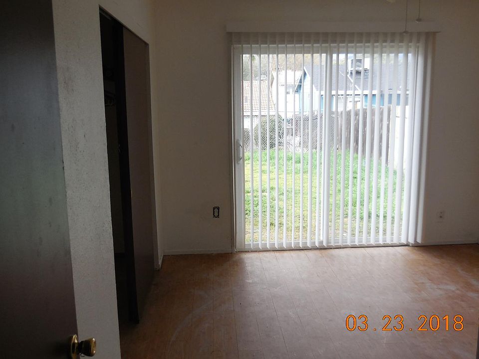 Bedroom 1 with access to the backyard