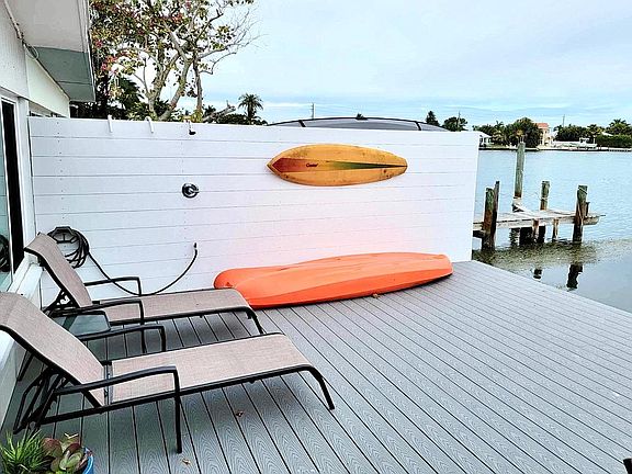 Deck with lounge chairs and outside shower