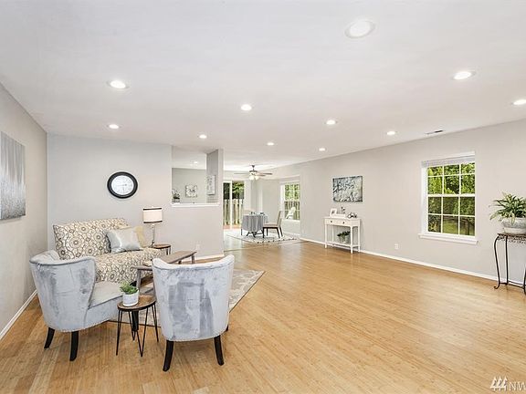 Who wouldn't want this enormous great room, with tons of new lighting, and large windows to let in all the natural light! There is plenty of space for everyone, whether you are entertaining or just hanging out.