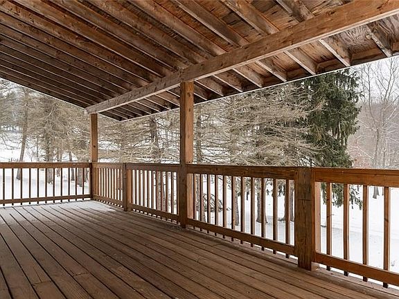 COVERED FRONT PORCH OFF GREAT ROOM WITH RAMP ACCESS TO SIDE AND BACK YARDS.