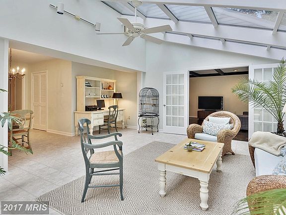 Solarium with entrance to spacious family room