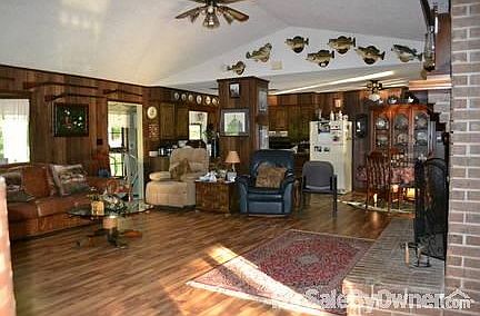 living Area or great room
						:
						Gas logs fire place,new floor it has a great view of lake from any area.