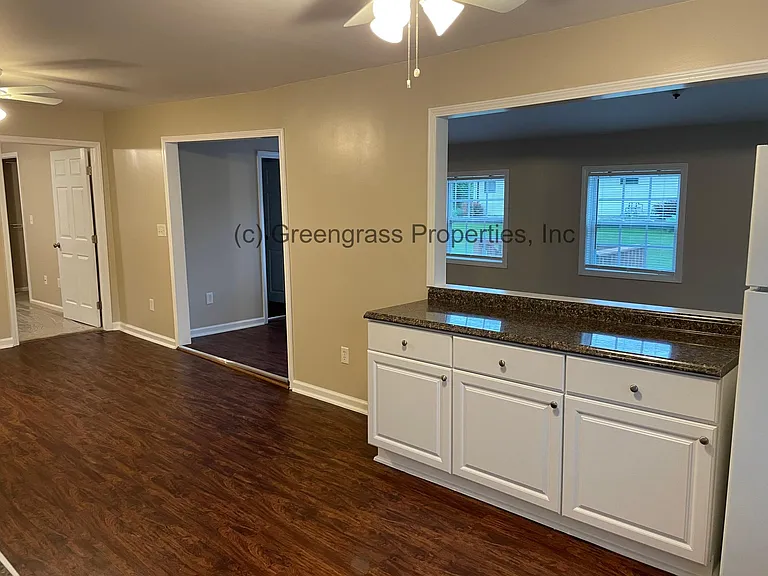 Kitchen Island, leads to enclosed porch area and half bath
