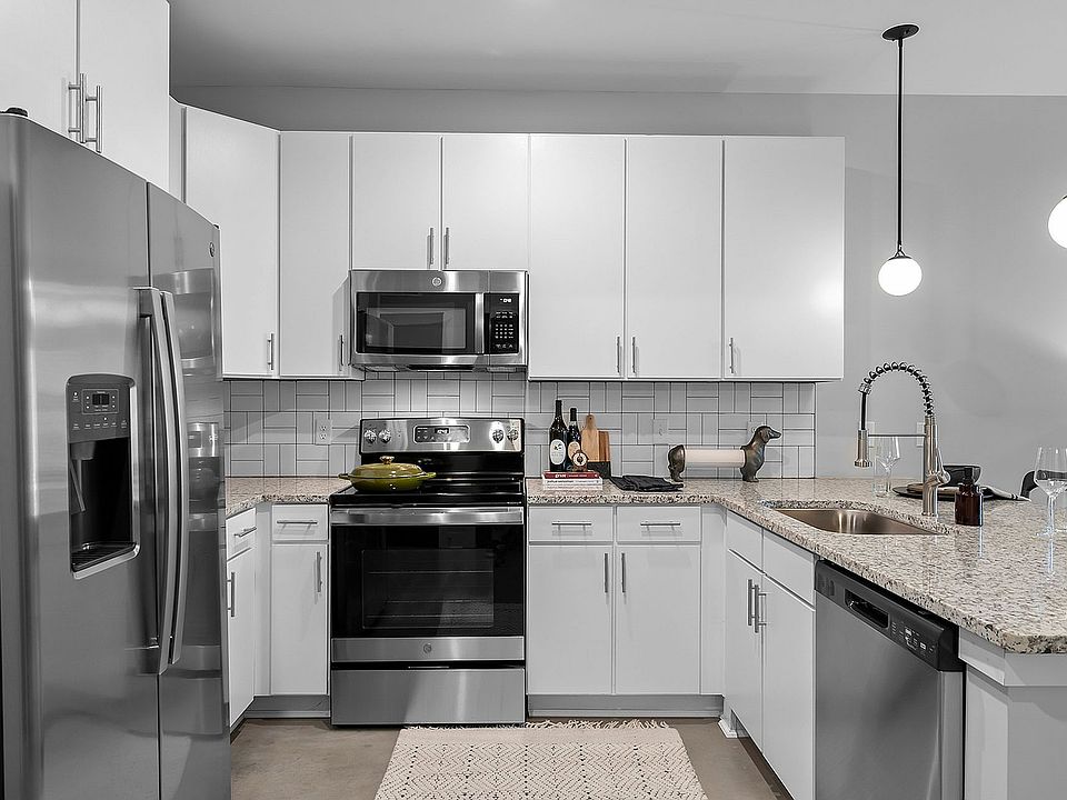 Kitchen with granite counters and modern cabinetry