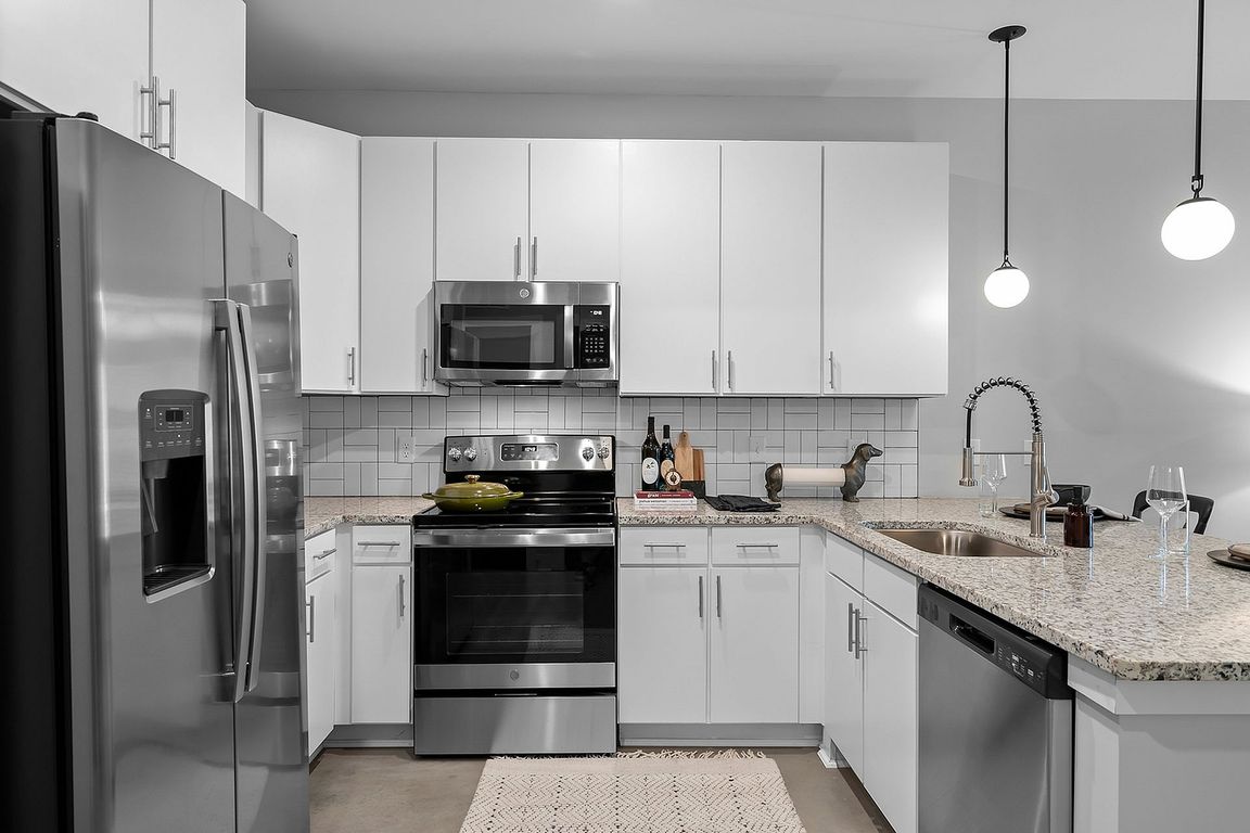 Kitchen with granite counters and modern cabinetry