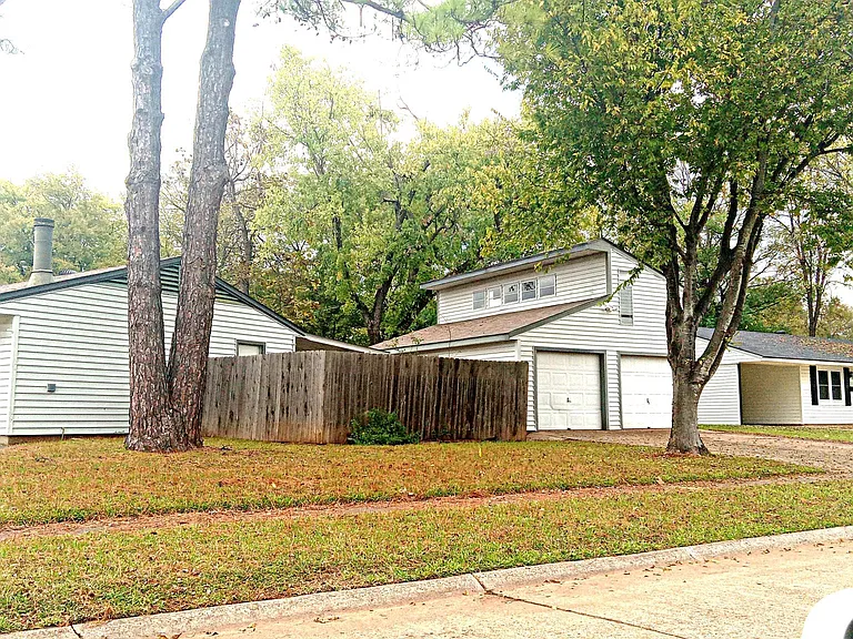 Side view showing the garage and loft behind the house to the left
the house to the right in the photo is not part of the property
This is a Great location in a Great Neighborhood