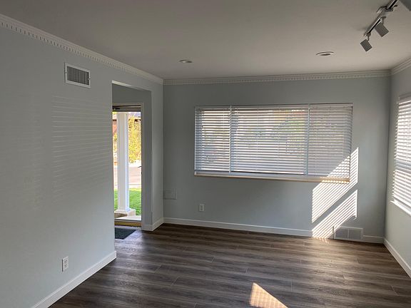 Completely remodeled with new floors, resurfaced/painted walls, ceilings, molding. New can & track lighting and blinds.