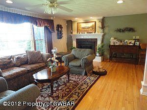 Living room ,HW floors &mantle
        fireplace