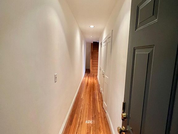 Hallway with two large built-in closets. Great for art.