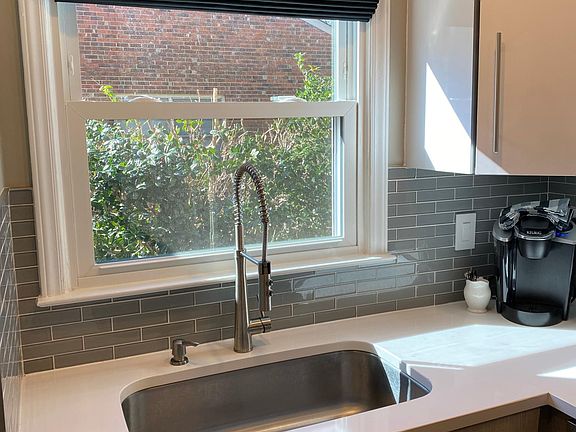 Quartz counter tops and glass subway tile backsplash