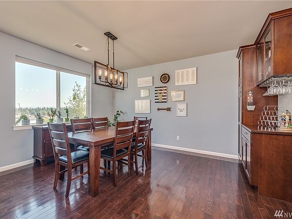 Dining room has dry bar cabinetry