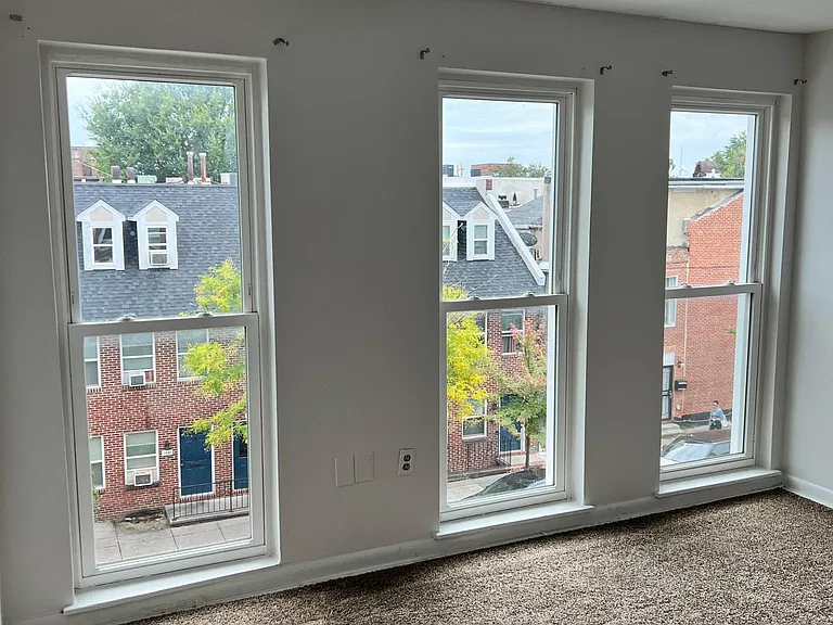 Head to the 3rd floor to find the 2nd bedroom with floor to ceiling windows
