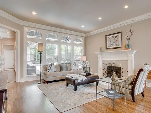 Living room offers view to private backyard and pool. Rich hardwood floors. Crown moldings, window casings and substantial baseboards. Recessed canned lighting. Neutral fresh paints. Gas log fireplace.