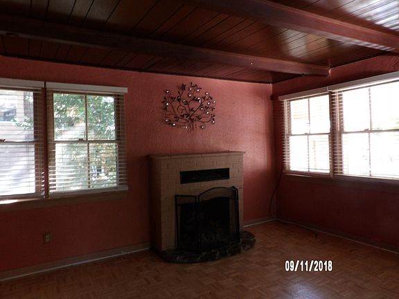 ROOMY LIVING ROOM WITH FIREPLACE.