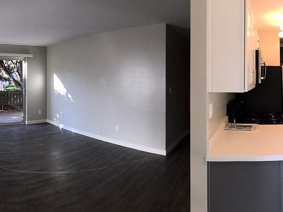 Living room with patio (with view of kitchen)