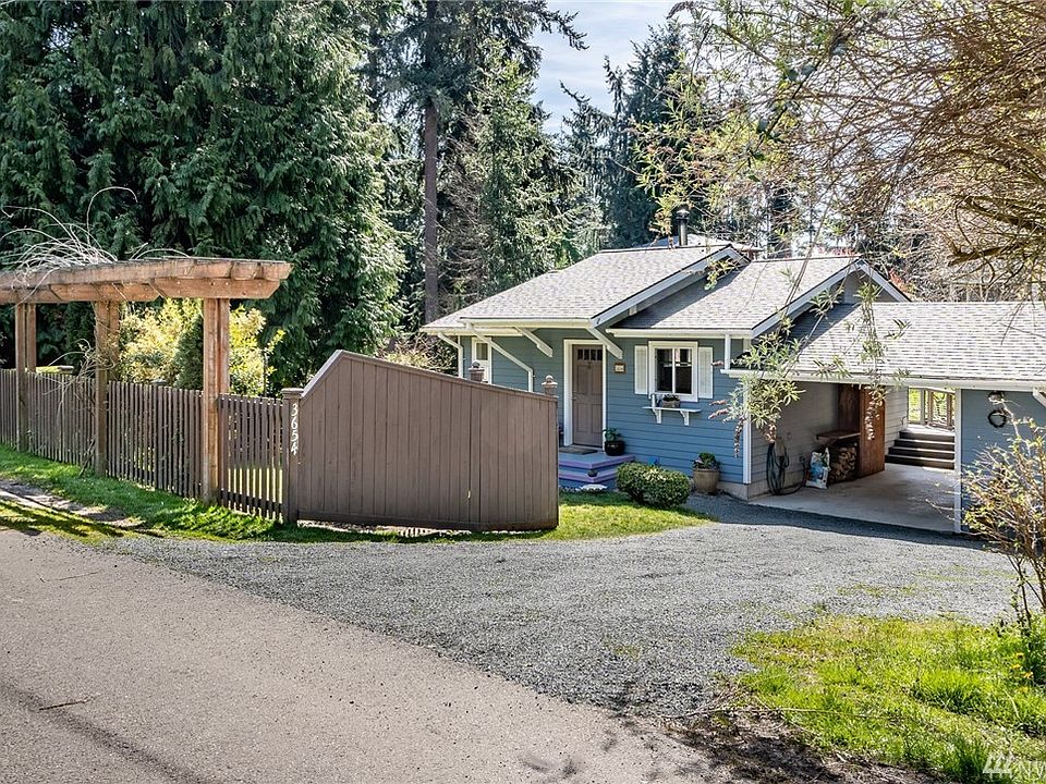 Here is an appealing home tucked in on an idyllic lot!  There is fresh gravel on the drive...