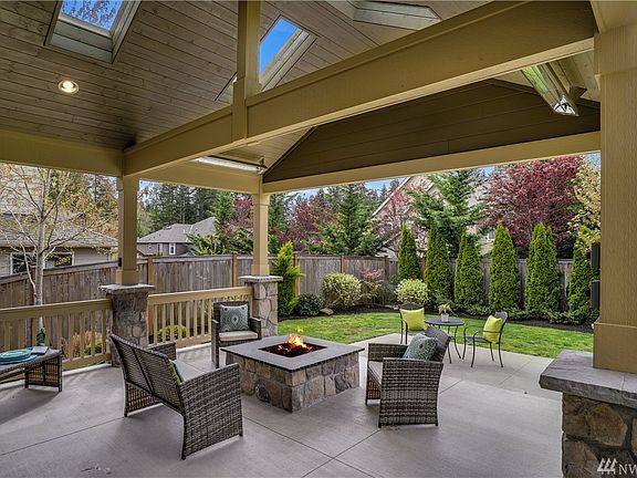 The Luxurious all Weather back patio will WOW you! Fully covered and fully fenced in. Heat Lamps, recessed lighting, electric outlets, skylights and so much more. This generous space is a haven for relaxing, dinning, Summer playtime, Dog runs and more!