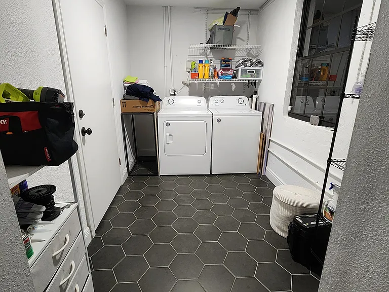 Laundry room with washer and dryer included.