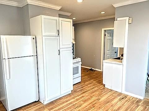 Fresh Paint, Large Pantry cabinet and off to the right is an additional Pantry