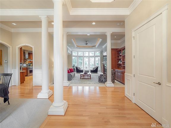 The 12' ceilings and 8' doors hint at the quality you'll find as you continue. The wide plank hardwoods underfoot support your initial impressions. 