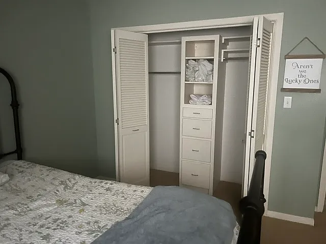 Bed room 2. Folding closet doors with built in cabinets.