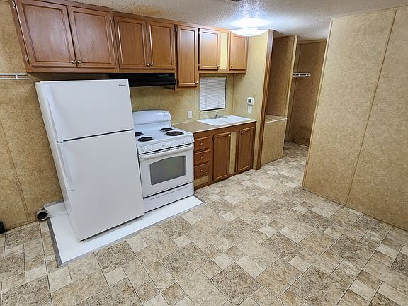 View of kitchen from front door. Bedroom is to the right of the kitchen