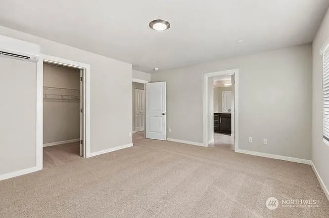 Spacious Primary Bedroom with Large Walk-In Closet and Ensuite Bath